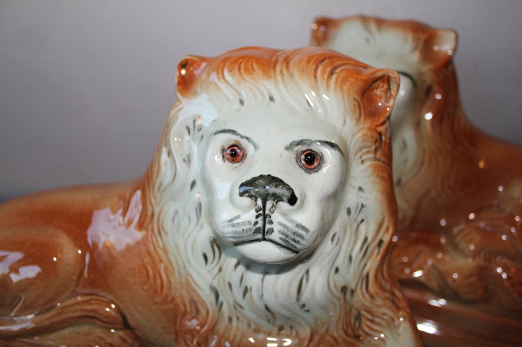 A nice pair of staffordshire dogs most likely spaniels of some kind. Nice glass eyes and good detail.