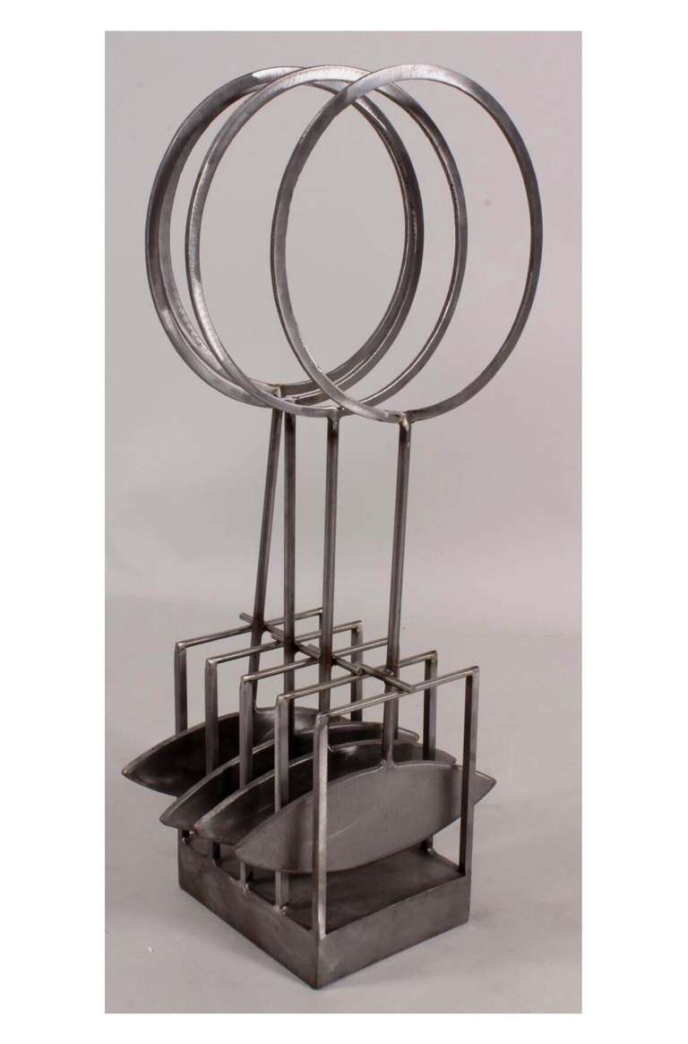 A truly amazing pice of sculpture this knetic piece by the noted artist Bruce Stillman was done in 1980 and is so stamped. It seems to be a perpetual motion machine with arcing pieces moving in a hypnotic rhythm. It is a large work of brushed steel