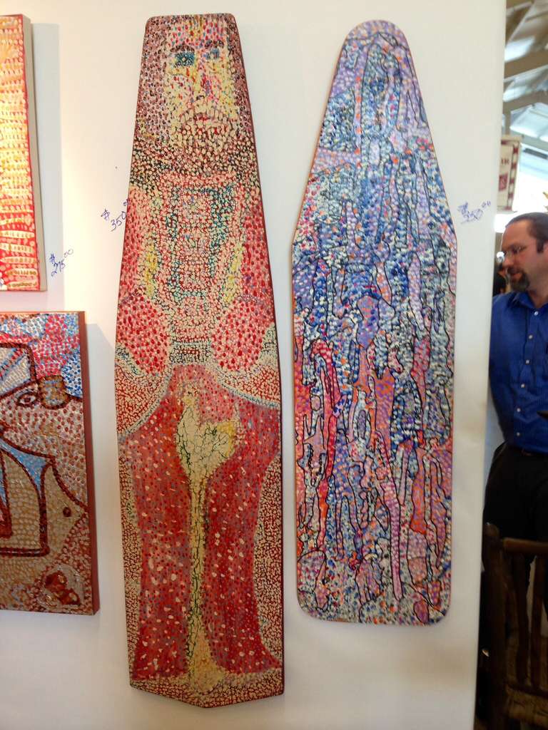 Two painted ironing boards by the noted Woodstock NY artist Michael Heinrich. One of the boards is monogrammed MH. These are acrylic on much older wood ironing boards. These are wonderful pieces done in Heinrich pointillist style of outsider Folk