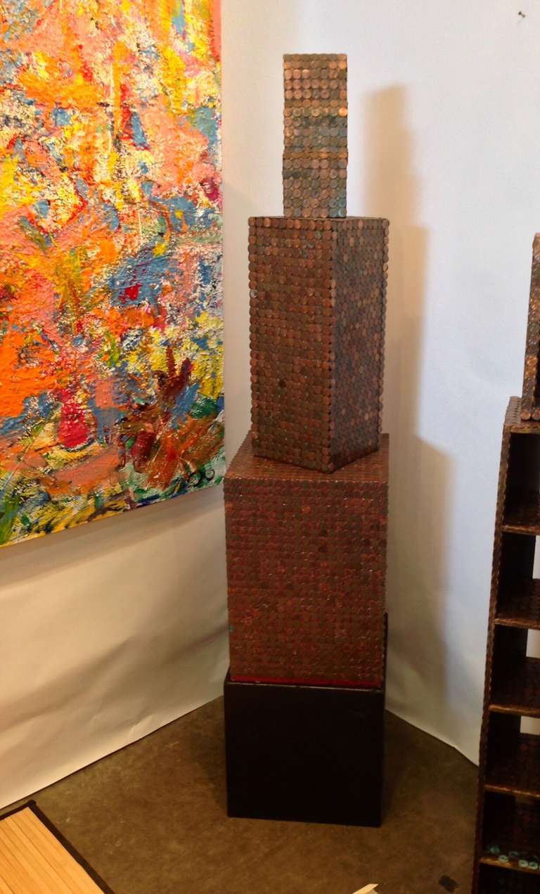 A great piece of outsider folk art in the form of a four-piece skyscraper. Each penny is glued on and they almost all are face up. This one is monogrammed on the base of the top piece mh 95. These were bought from the estate of the artist Michael