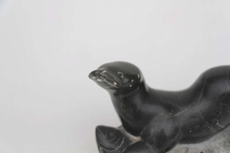 Folk Art Older inuit sculpture of seal or walrus catching a fish