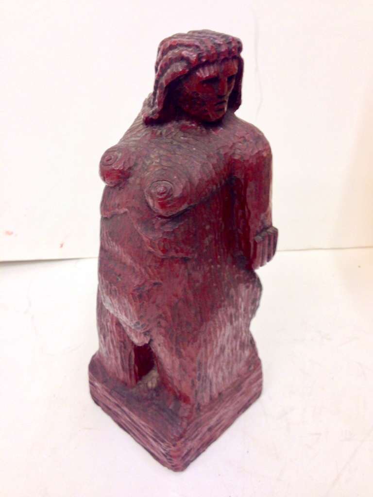 A uniquely stylized direct wood carving of a nude woman. Unfortunately I cannot find any signature. Well executed.