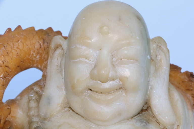 Asian carving of a smiling Buddha with cat and dragon 4