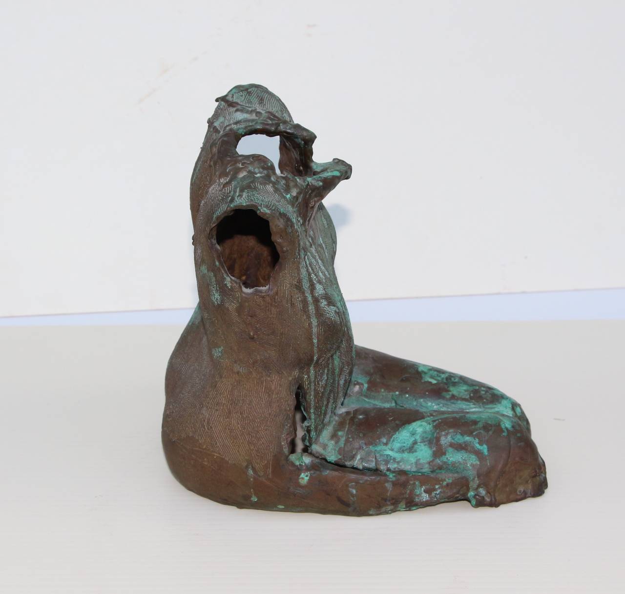A nice well done bronze of a nude woman's torso with great patina. It is not signed that we can find.