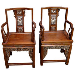 Two 19th Century Heavily Carved Chinese Hardwood Armchairs
