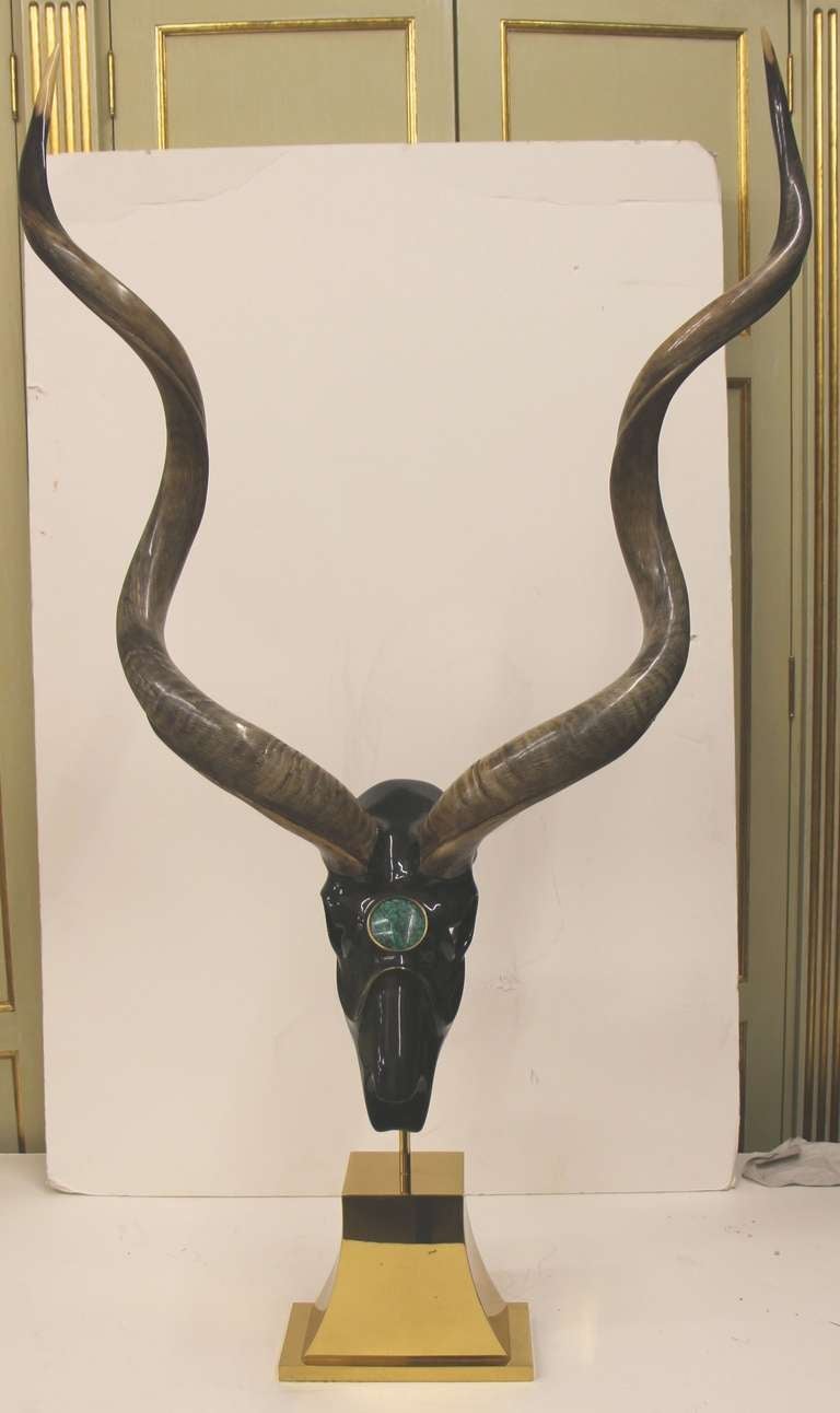 A rather striking and complete kudu sculpture with real malachite inlay from the noted accessory firm of Jonson Cornell Ltd. This firm supplied Bergdorf Goodman, Henri Bendel and Bloomingdale's with jewelry and Karl Springer with accessories,
