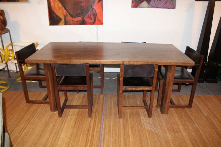 A beautiful and solid walnut and leather dining or kitchen set. This company founded by Tyler Hayes makes only the best in custom furniture and is considered one of the best custom makers in the trade. The company guarantees it's work and has