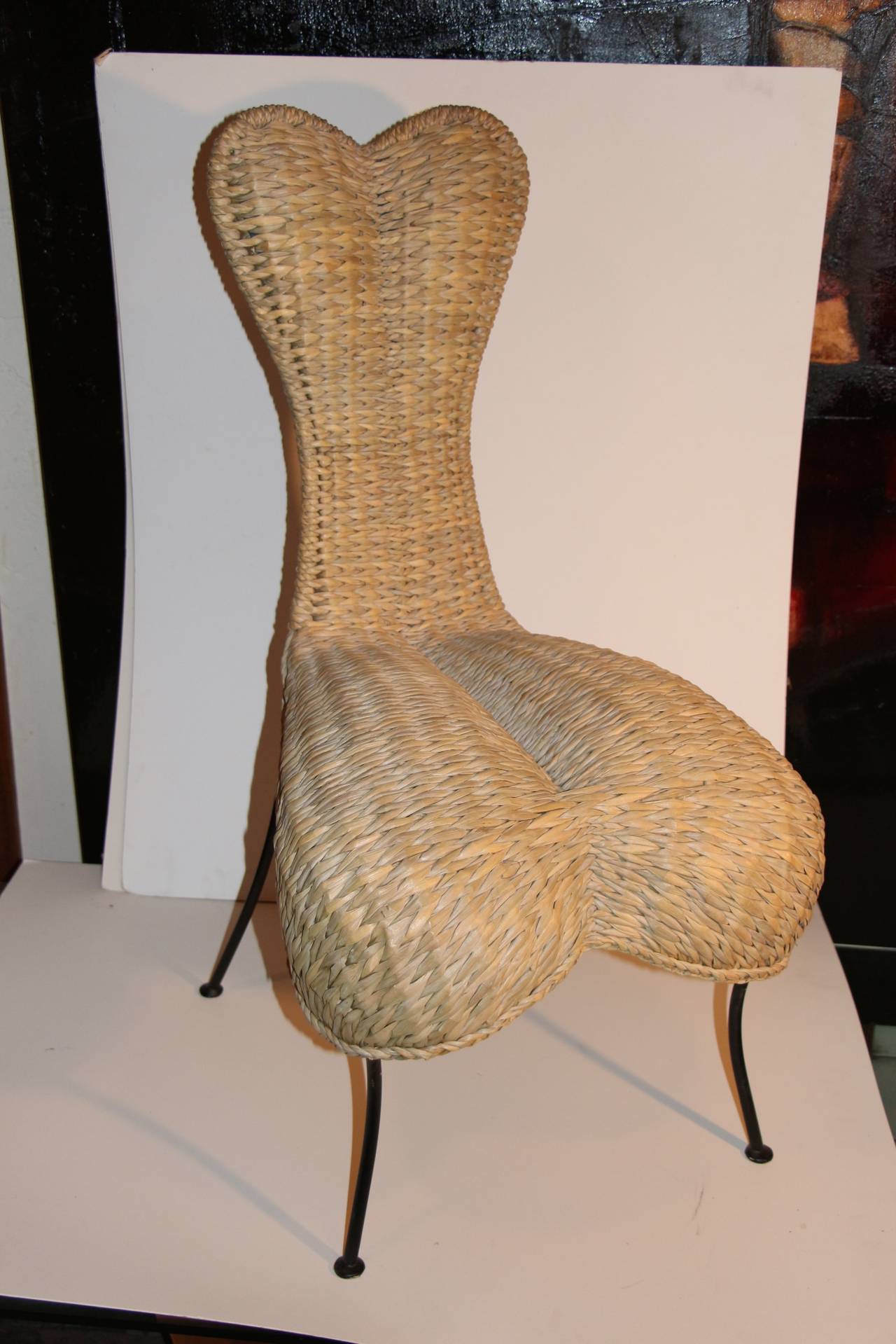 A really unique woven reed or rush chair in the shape of a heart. Looks very much in the vein of Tom Dixon's woven chairs or Marc Newson's. This chair may be a prototype as it appears to be hand finished underneath. In any event a most unusual