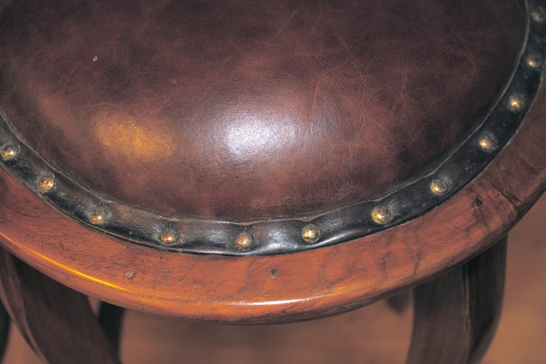 Pair of vintage leather top oak bar stools