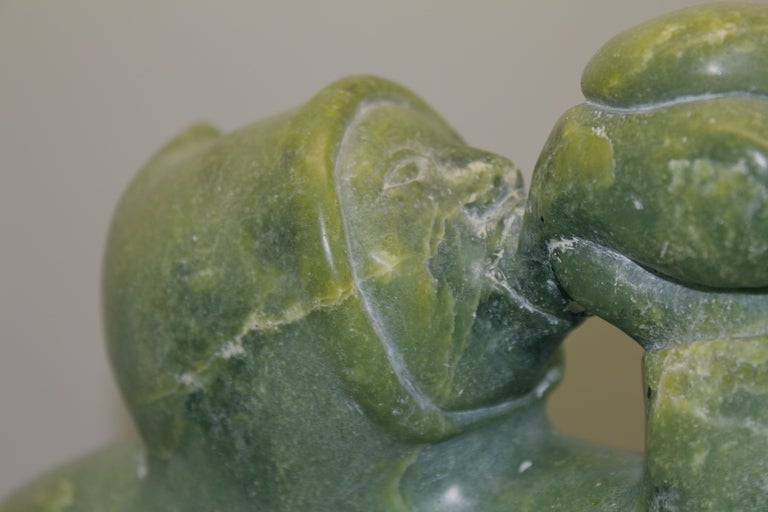 A wonderful Eskimo Inuit carving in a great color of soapstone. We rarely this this wonderful shade or hue of green and were fortunate to come across a collection of some. Nice large size and subject.