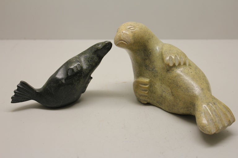 A nice duet of Eskimo or inuit carvings of a walrus and a seal.they appear to be hardstone carvings. nice form and detail. Size given is for the larger one the smaller one is slightly smaller.