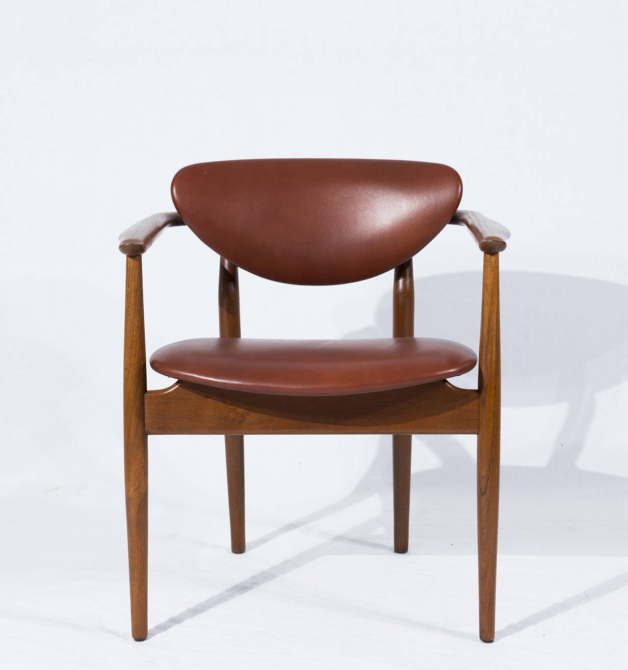 Finn Juhl NV 55 (also known as FJ 55) armchair designed in 1955 and produced by Niels Vodder. Chair is signed Niels Vodder.  Store formerly known as ARTFUL DODGER INC