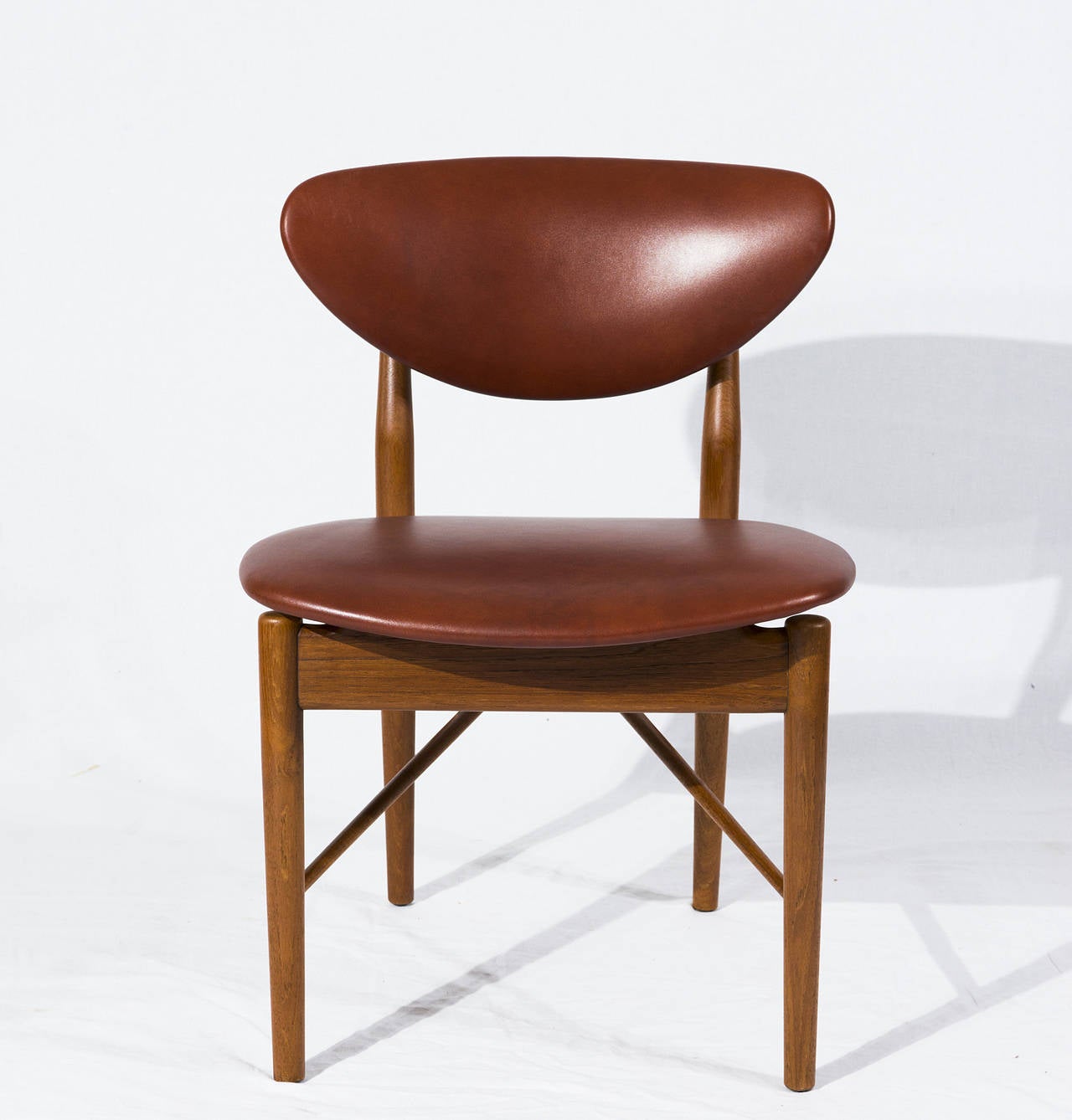 Finn Juhl NV 55 (also known as FJ 55) side chair designed in 1955 and produced by Niels Vodder. Chair is signed Niels Vodder.  Store formerly known as ARTFUL DODGER INC