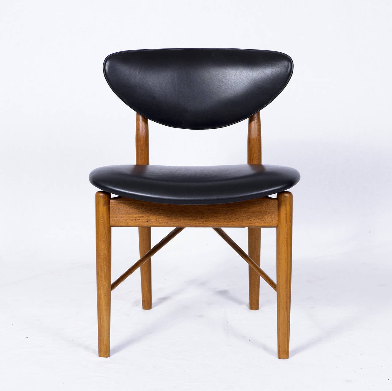 Set of six Finn Juhl NV 55 dining chairs designed in 1955 and produced by Niels Vodder. Chairs are signed Niels Vodder.    Store formerly known as ARTFUL DODGER INC