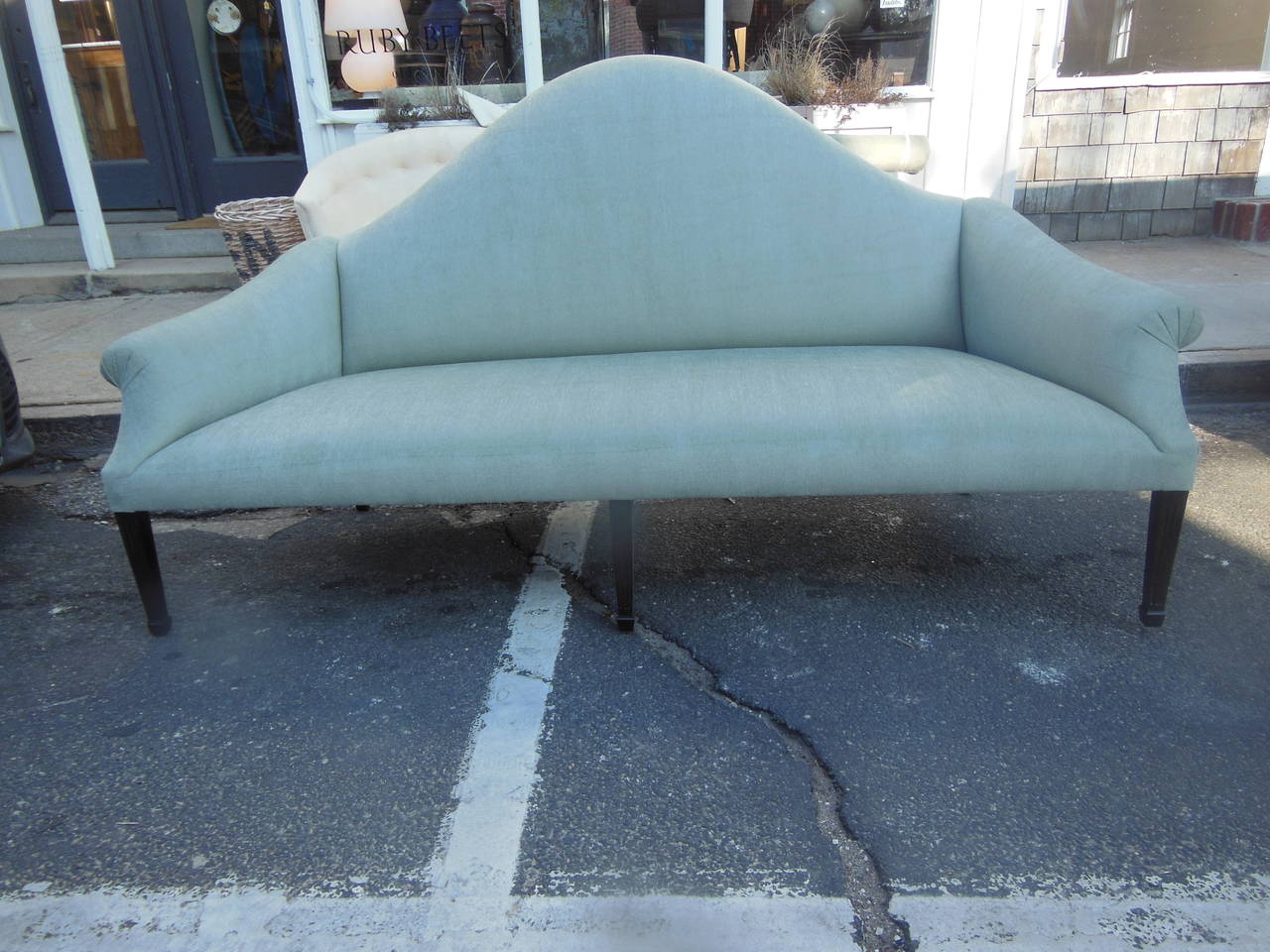 a beautiful  vintage 40's inspired exaggerated camel back sofa  on dark fluted legs in gray/green Italian chenille