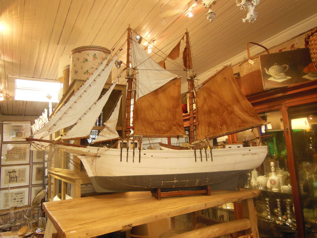 a great painted boat model circa  1940 with lifeboat and lots of detail in nice old paint on a stand