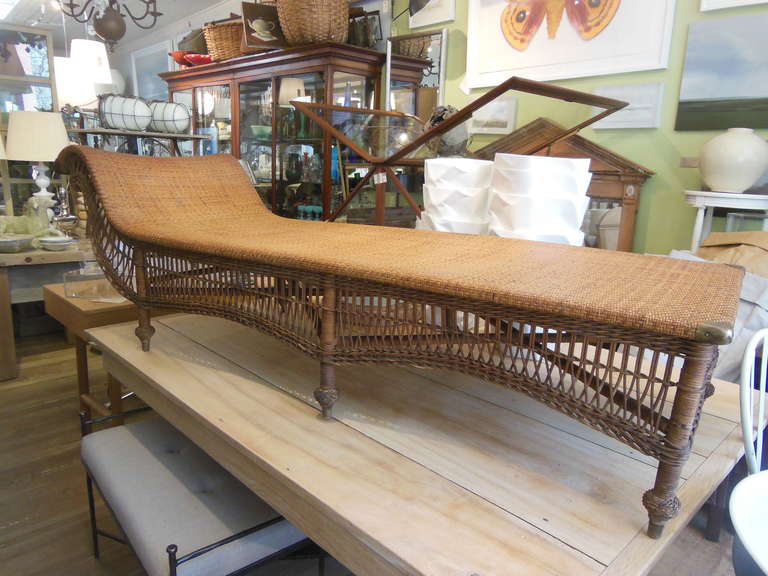 a beautiful chaise with woven seat