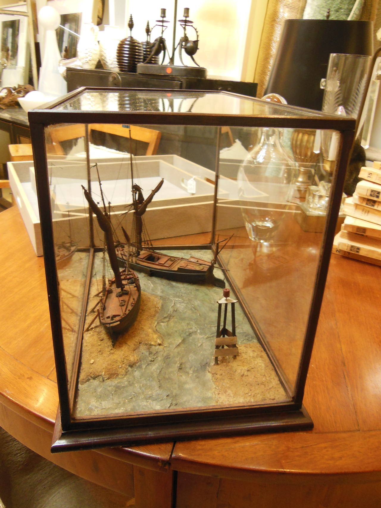 a river diorama featuring 2 boats with wonderful  detail in a fine glass case