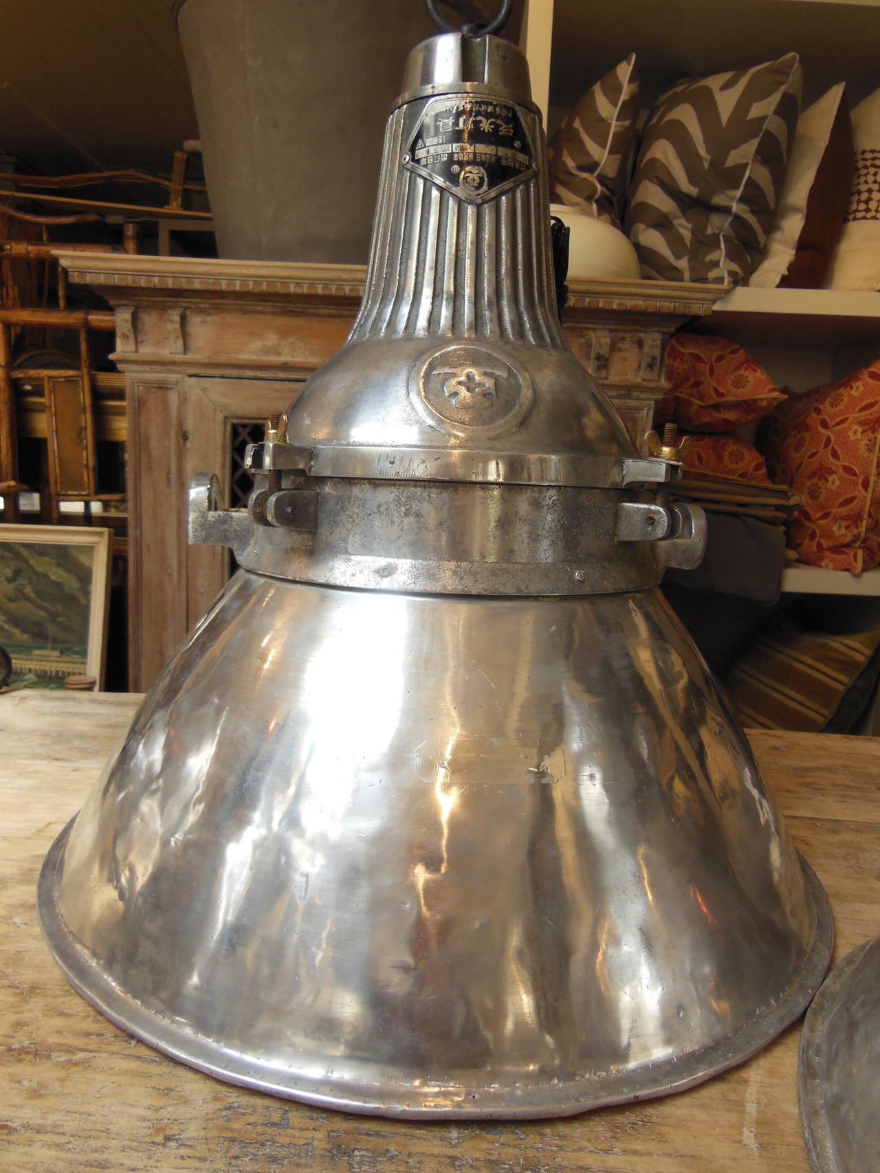 A pair of large vintage steel industrial lights with diffusers