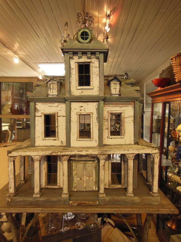 A fantastic dollhouse in great paint with copper mansard roof and great architectural detail.