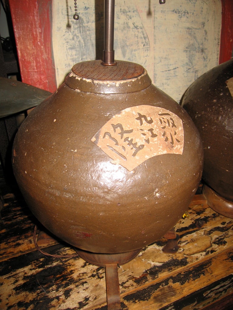a pair of pots with Chinese character decoration on wood bases newly rewired