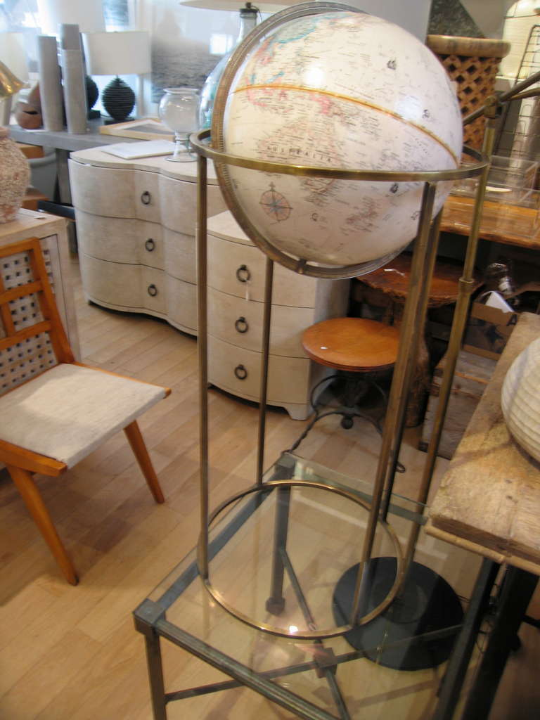 a nice  vintage globe on brass stand