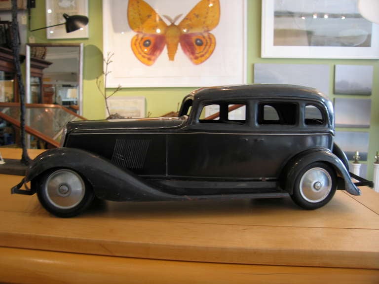 Vintage toy sedan in excellent condition by Toto Toys.