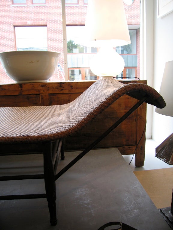 Heywood Wakefield woven rattan lounge with brass fittings
