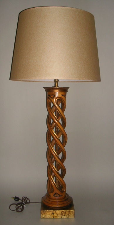 James Mont style 1950s carved helix bleached mahogany table lamp with gilt edges on gilt block base, newly wired with new mottled paper shade.