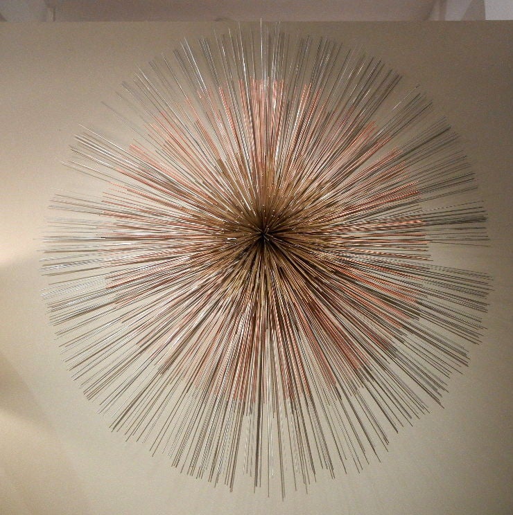 A signed Curtis Jere multi-toned metal wall sculpture comprised of three coencentric circles, the zinc center protruding from the two different lengths of thin copper and steel rods.<br />
<br />
Keyword Search: 1stdibs, Curtis Jere, Artisan