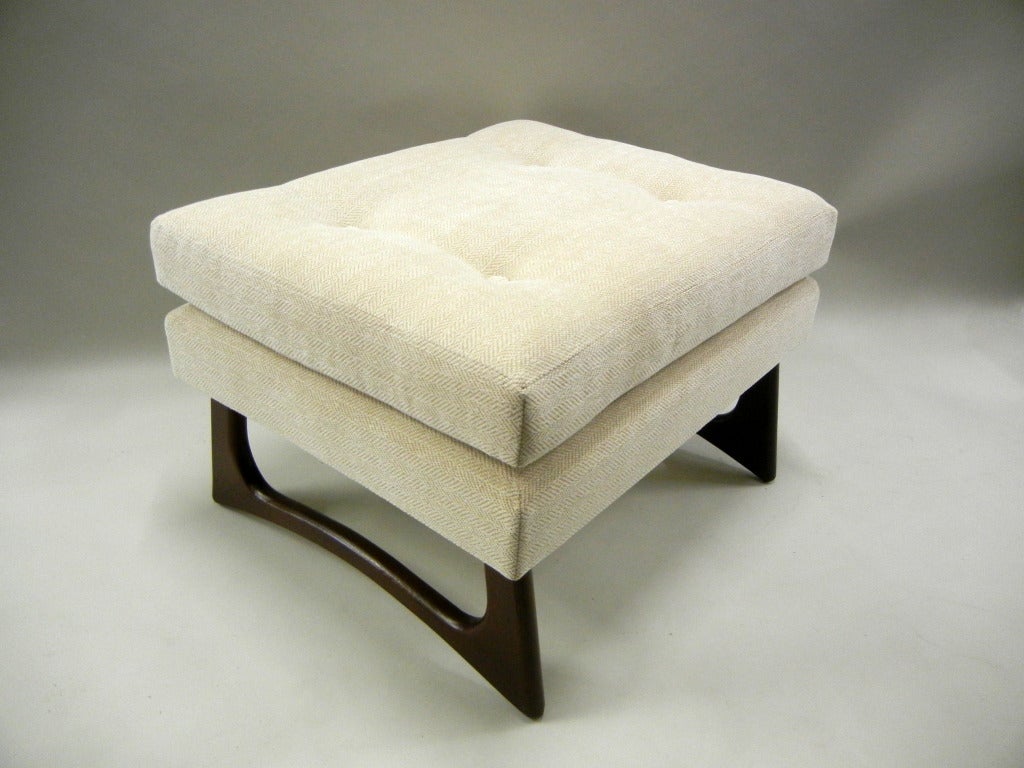 A pair of Mid-Century ottomans/footstools/benches by Adrian Pearsall
with rectangular tufted cushions on upholstered platforms resting
on shaped walnut sleigh bases, newly upholstered in herringbone
tone on tone chenille.

Keywords Search: