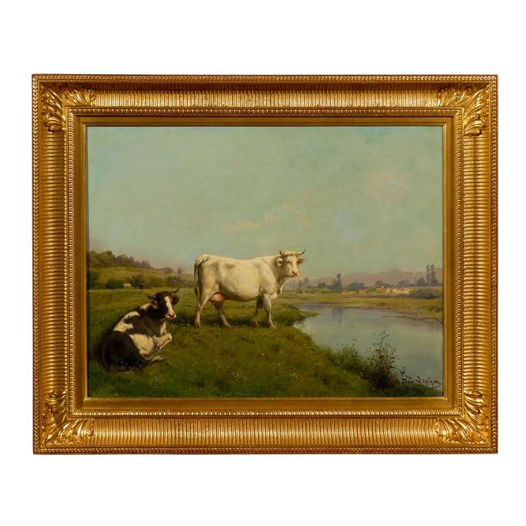 Une huile sur toile réaliste française représentant des vaches dans un cadre pastoral par l'artiste Théodore Levigne (1848-1912) de l'École de Lyon. Cette huile sur toile de taille moyenne a été créée à la fin du XIXe siècle par Théodore Levigne, un