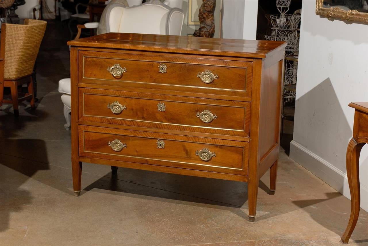 French 18th century Louis XVI commode with bronze banding and three drawers.