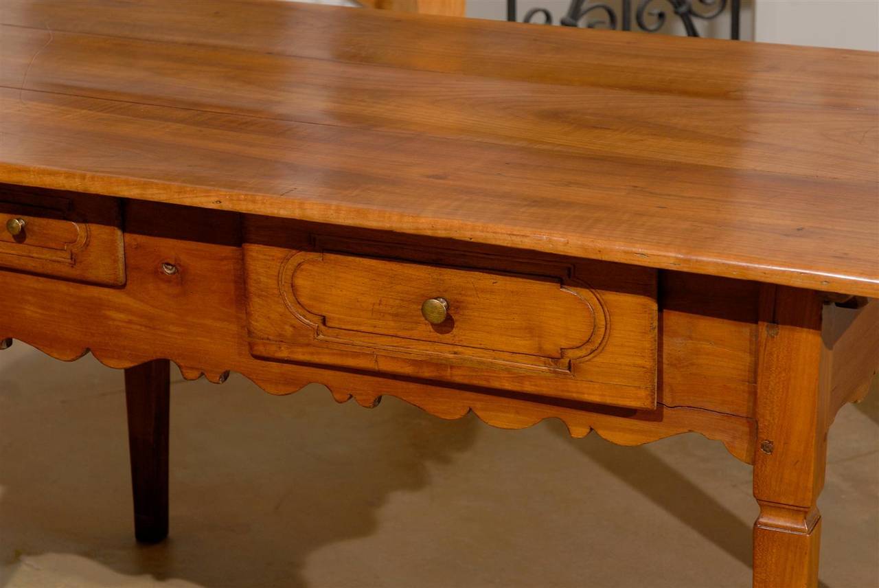 French 1890s Fruitwood Two-Drawer Table with Scalloped Apron and Tapered Legs 1
