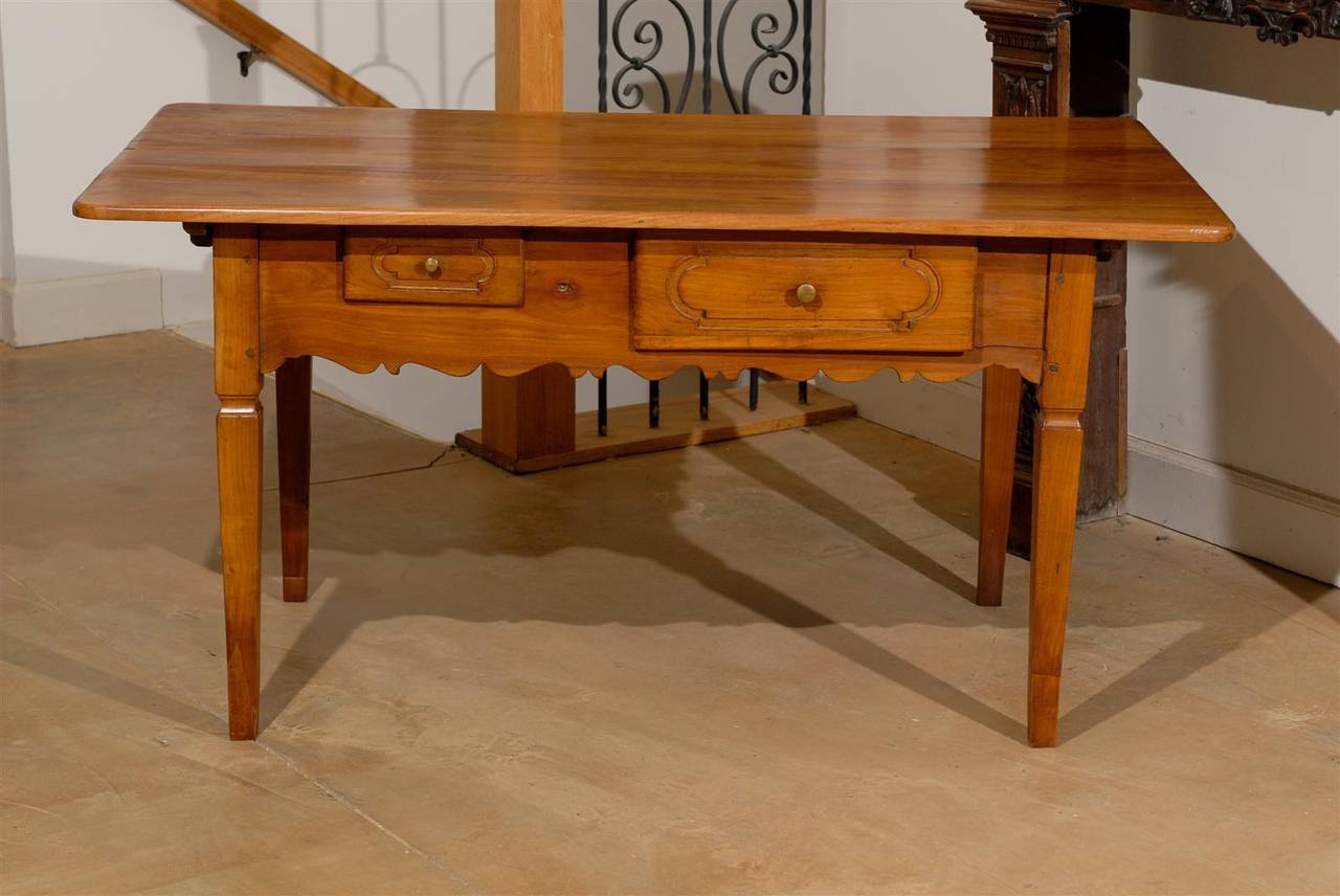 19th Century French 1890s Fruitwood Two-Drawer Table with Scalloped Apron and Tapered Legs