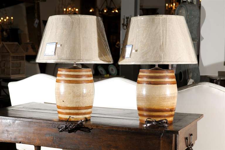 Set of four 19th century spirit barrels mounted as lamps. From England, circa 1880. Please note these are one of a kind items and are antiques.