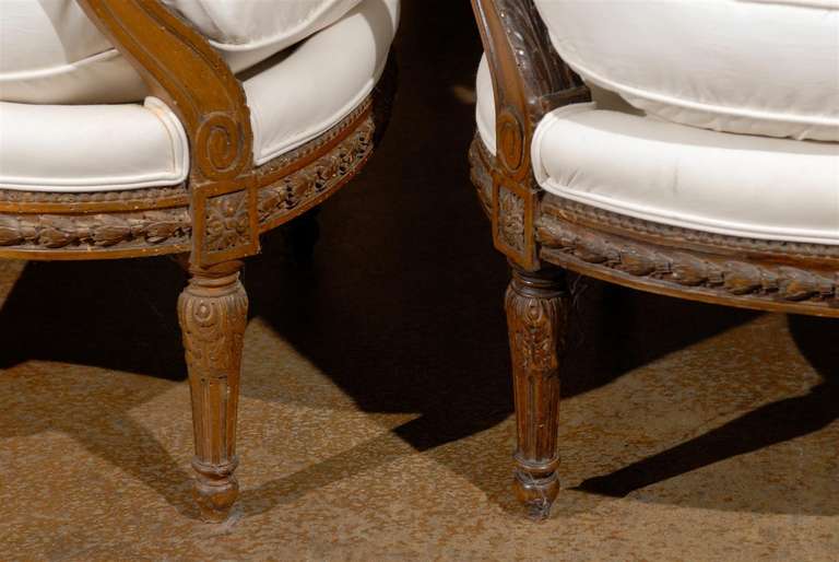 Wood Pair of French Louis XVI Style Upholstered Armchairs from the Early 19th Century
