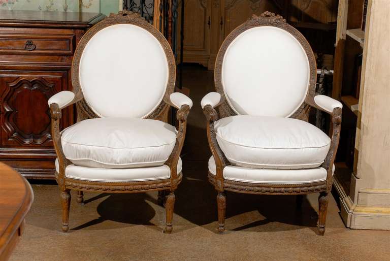 Pair of French Louis XVI Style Upholstered Armchairs from the Early 19th Century In Good Condition In Atlanta, GA