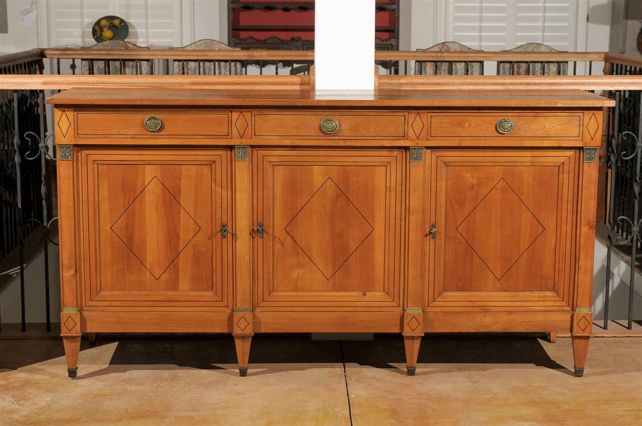 French early 20th century Directoire style enfilade with three drawers over three doors.