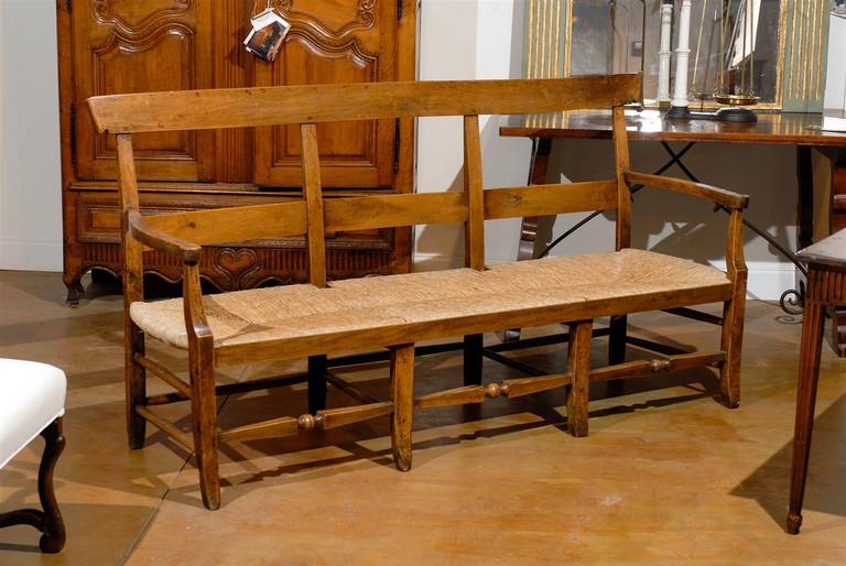 Elegant 19th century French bench with rush seat. Excellent stabile condition. Rush seat is in perfect condition.