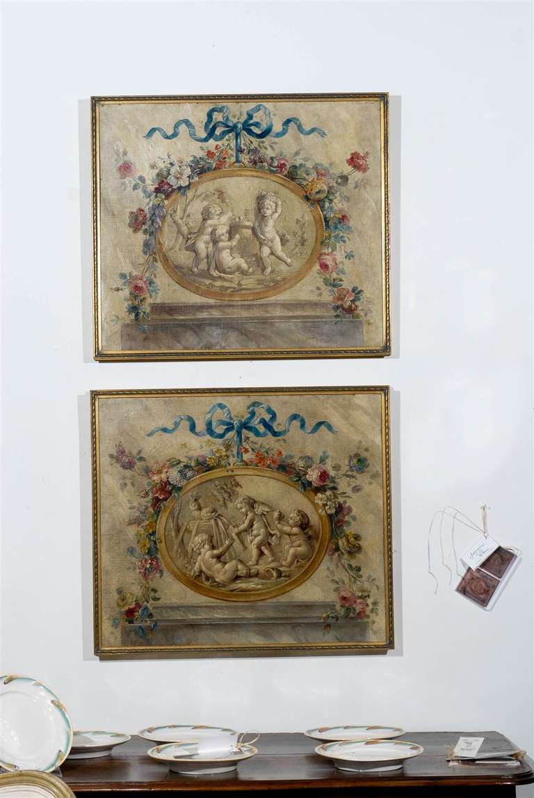 Pair of 19th Century French Grisaille Oil Paintings of Mythological Scenes Surrounded by a Rich Floral Border. Please Note These Item are Antiques. Two Pairs are Available. Please Refer to Our Website for Our Complete Inventory- jadamsantiques.com