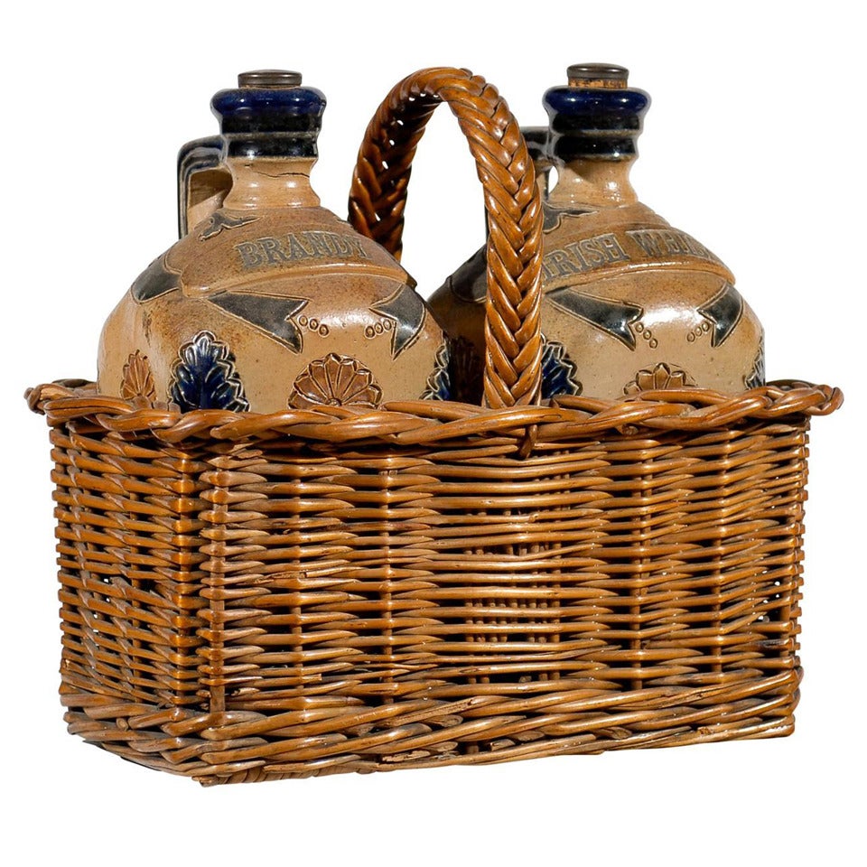 Two Victorian English Pottery Decanters in Tantalus-Inspired Wicker Basket For Sale