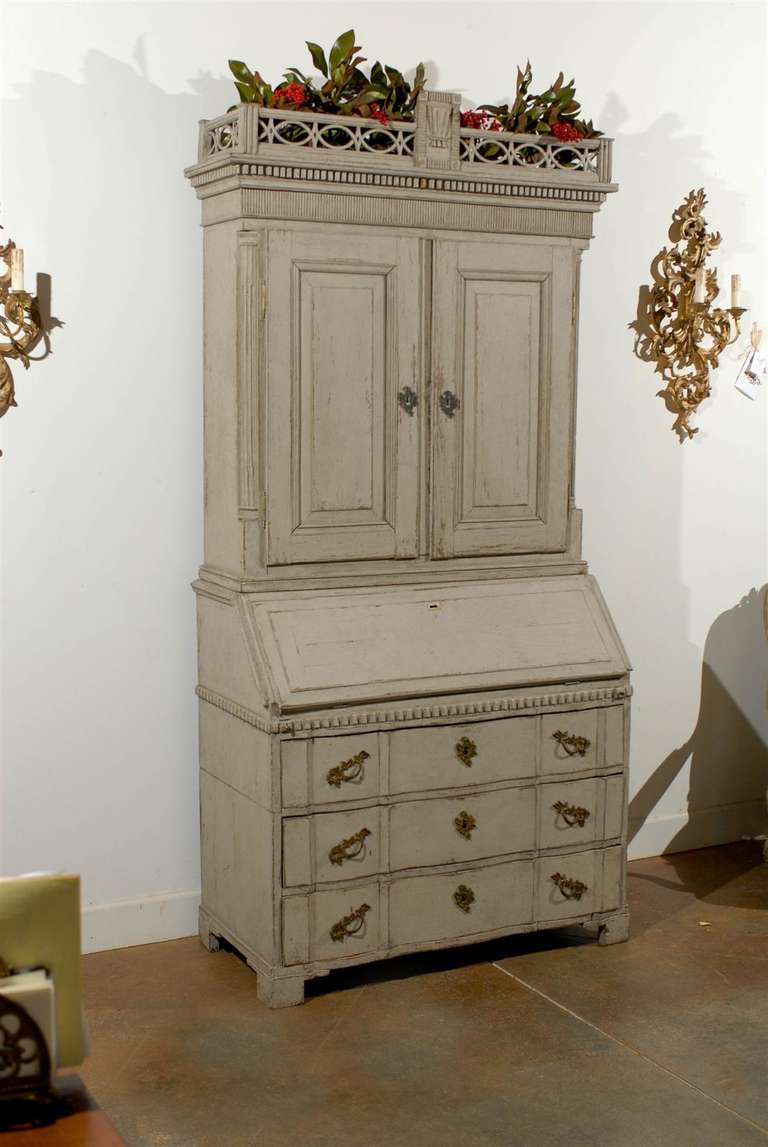 A Danish 18th century tall secretary with provenance plaque indicating 'The State of Denmark'. This Scandinavian secretary was born in the second half of the 18th century in the kingdom of Denmark. In addition to a light color palette, typical of