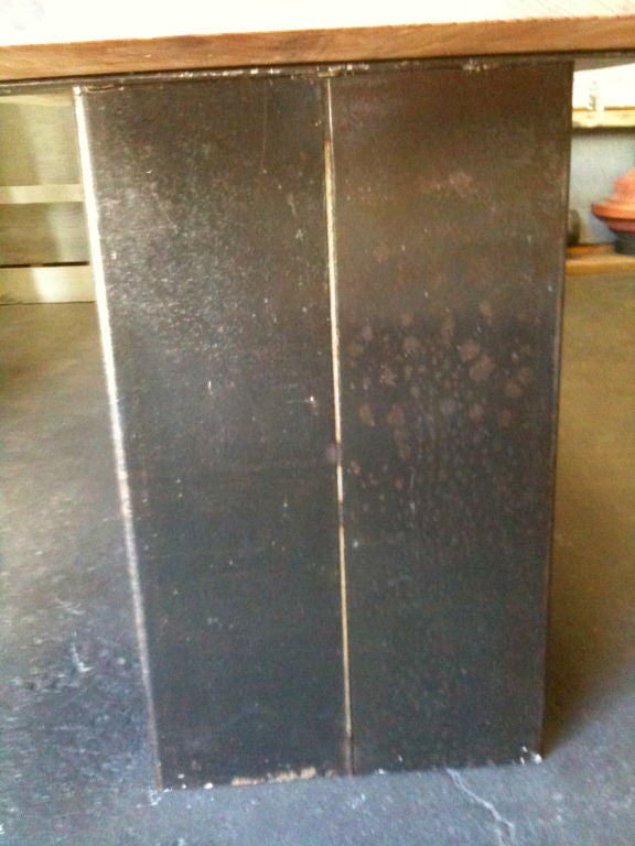 custom steel base with a recycled, redwood slab atop.  these can be made to order for offices or home.  various types of wood and finishes as well as base finishes.  fantastic for dining, desk, sofa back, headboard centered/floating in room and even