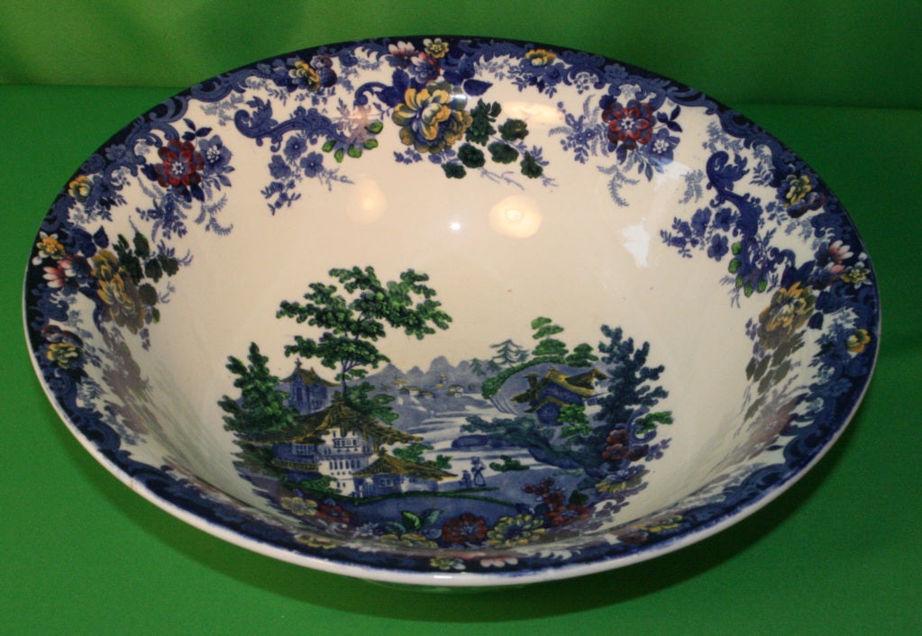 English Minton 'Genevese' Ewer & Bowl Set.   Asian and floral theme.  Prime condition throughout (no chips, repairs etc.) 
Strong cobalt blue with red & orange flowers.  Minton stamps and numbers on the bottom of both pieces.
Size:  Ewer 9ins high