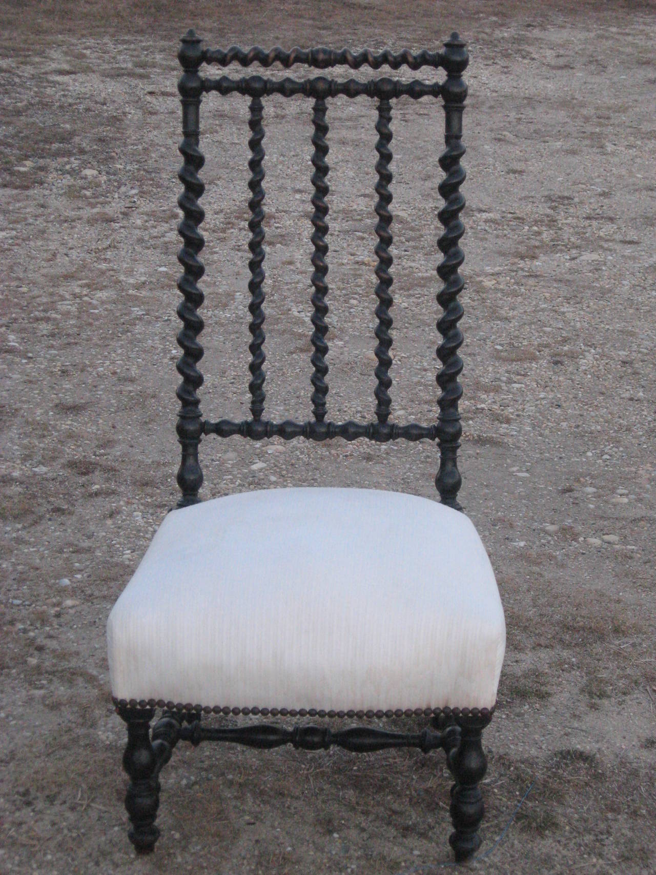 Rare 19th century American ebonized spindle upholstered slipper chair.