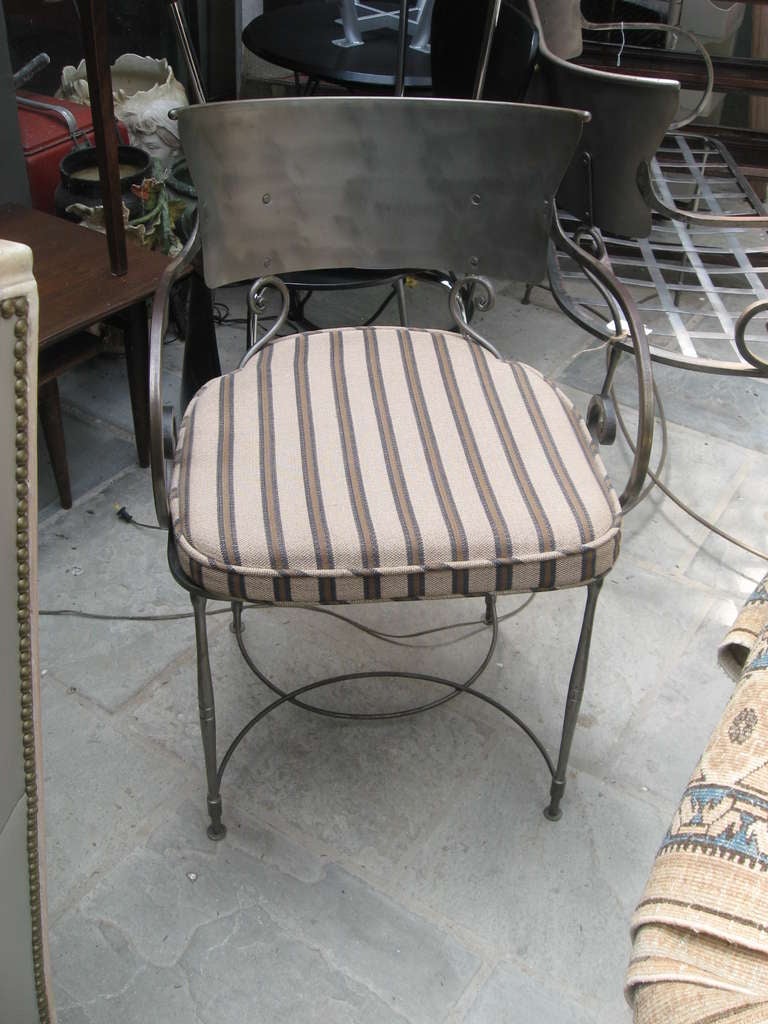 Pair of Italian brushed iron chairs with steel made cushions.
Height with cushion 19