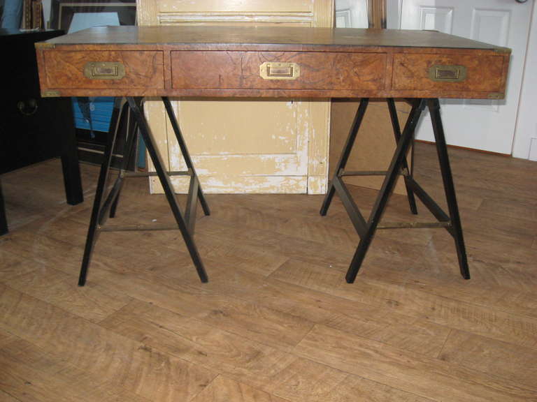 Midcentury burl wood Campaign desk on ebonized detachable legs with brass drawer pulls and side handles.