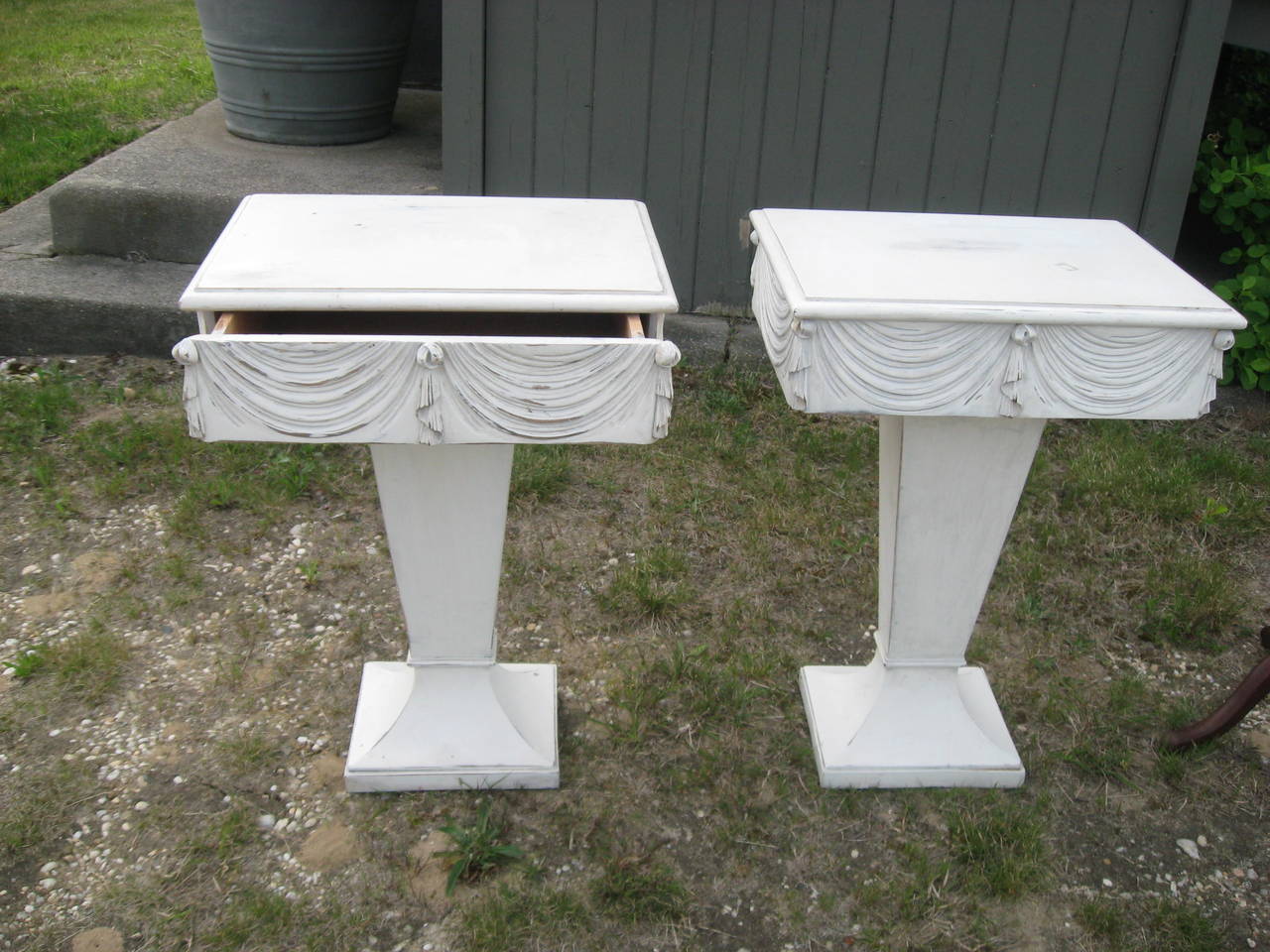 Grosfeld House pair of side or night tables with drawers and drape design on
all sides.
