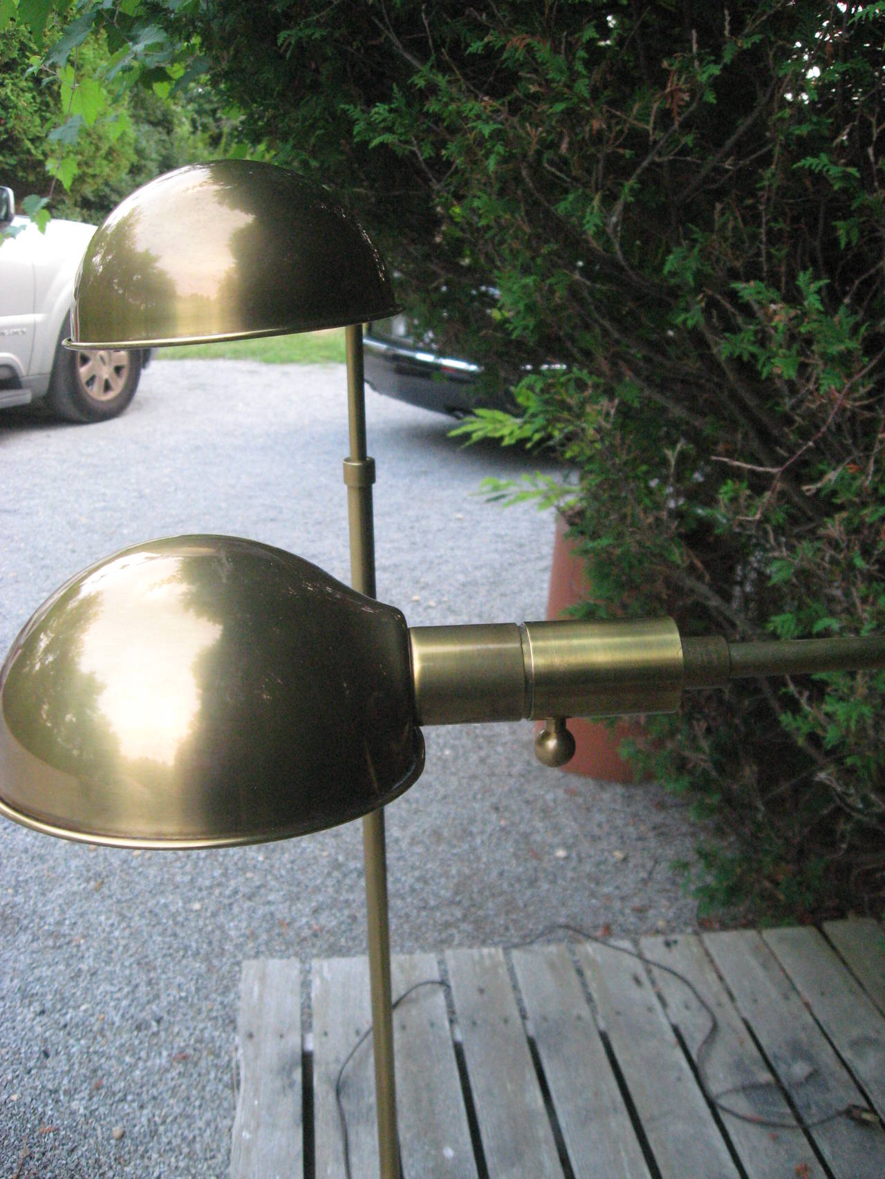 Pair of vintage adjustable brass floor/reading lamps by Chapman
with dimmer switch, circa 1972. Adjusts from 39